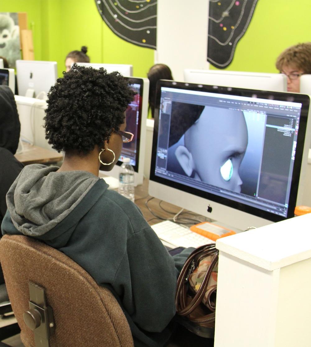 Student using software on a computer to animate.
